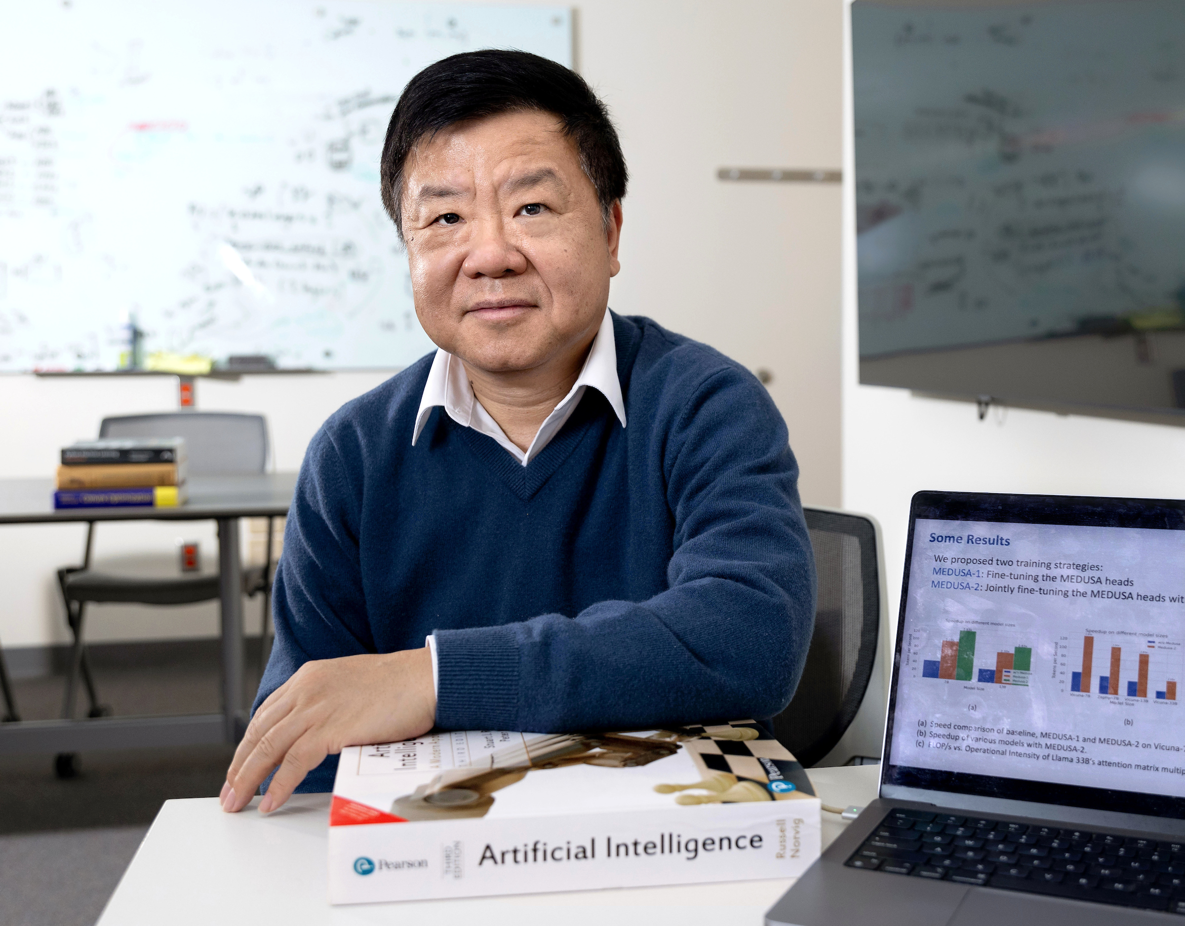 Deming Chen in his office, posing for a photograph