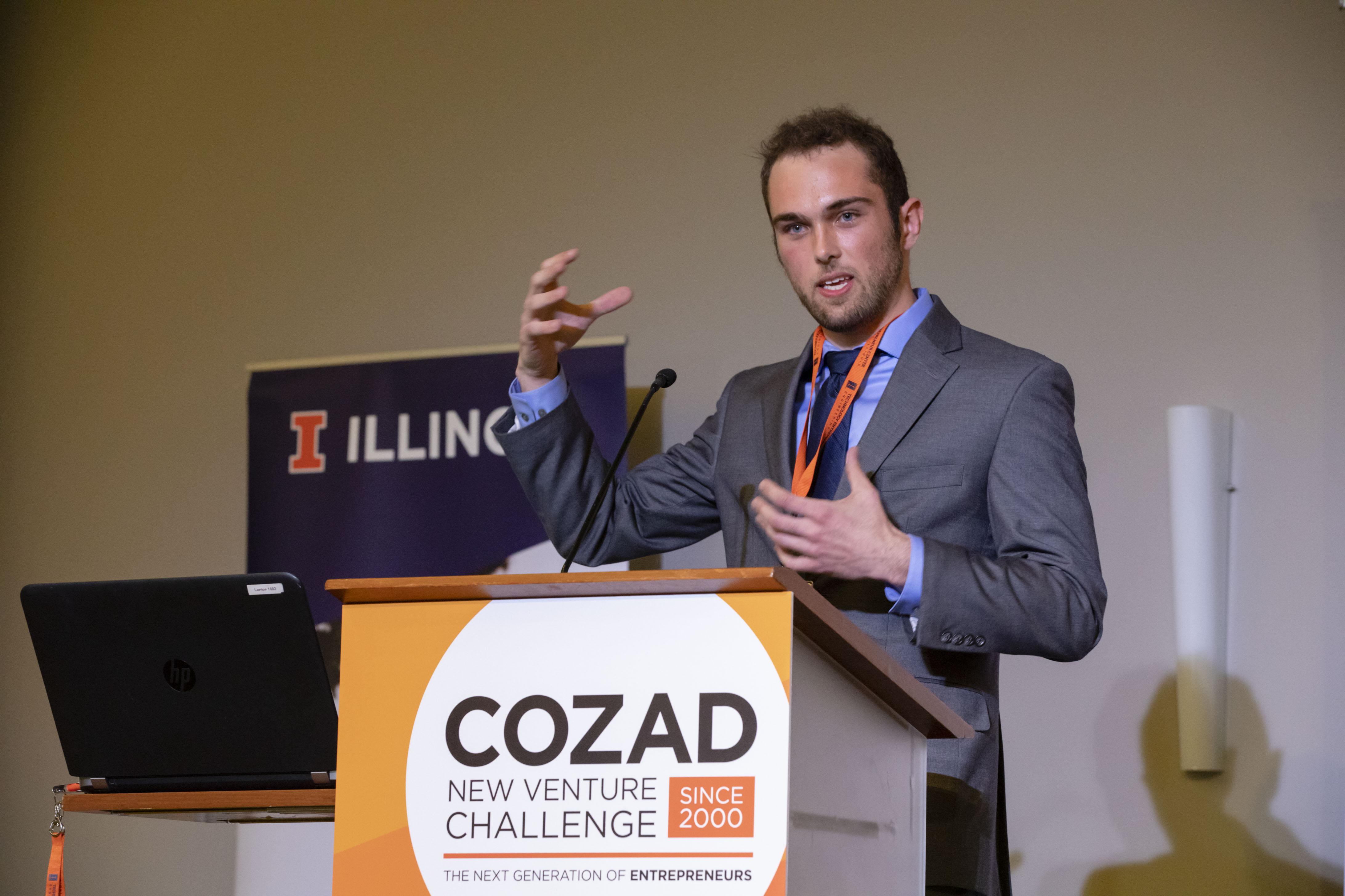 Brandon Yates behind a podium during Cozad competition.