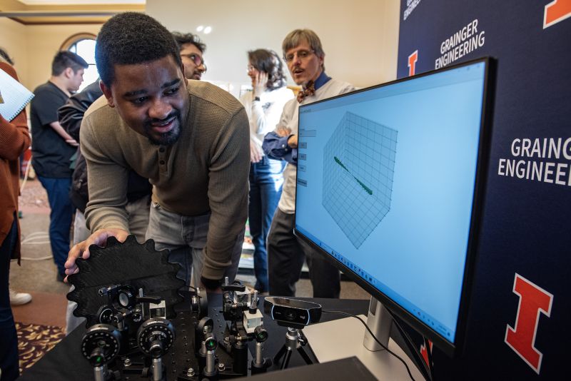 A man interacts with the Public Quantum Network