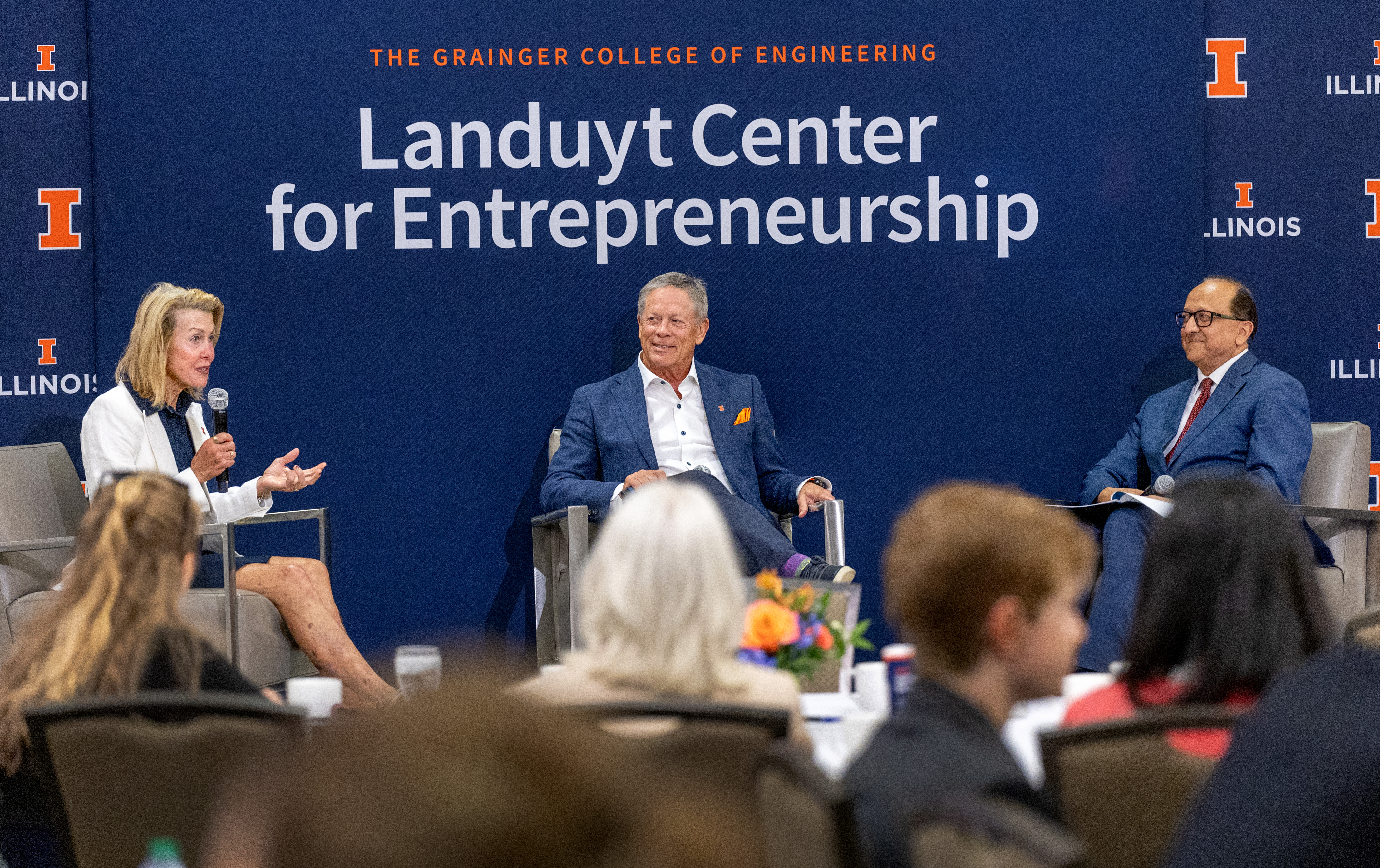 From left to write, Gayle Landuyt speaks while Richard Landuyt and Dean Rashid Bashir listen during a fireside chat.