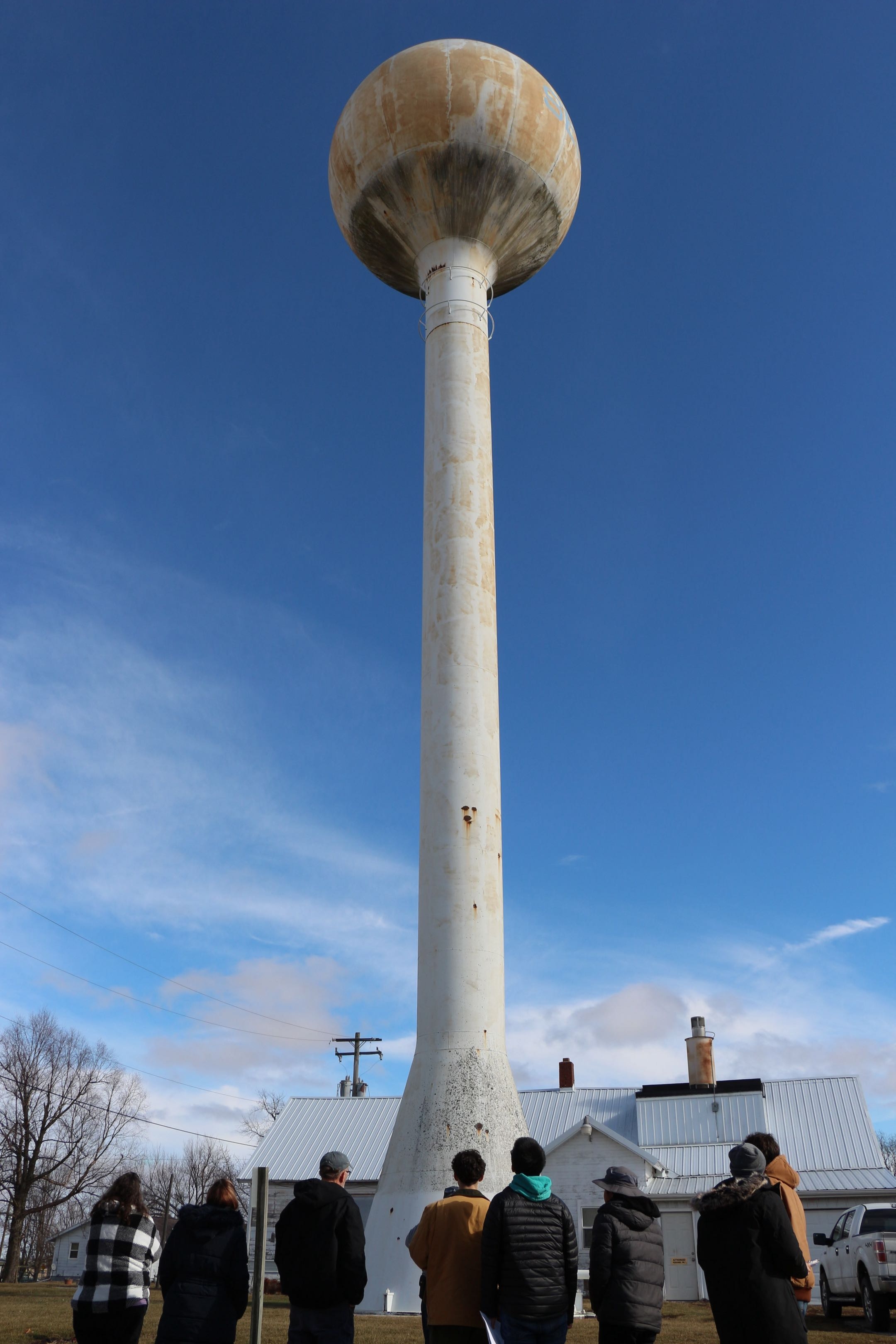 EWB volunteers look up at the Woodford, IL water tower.