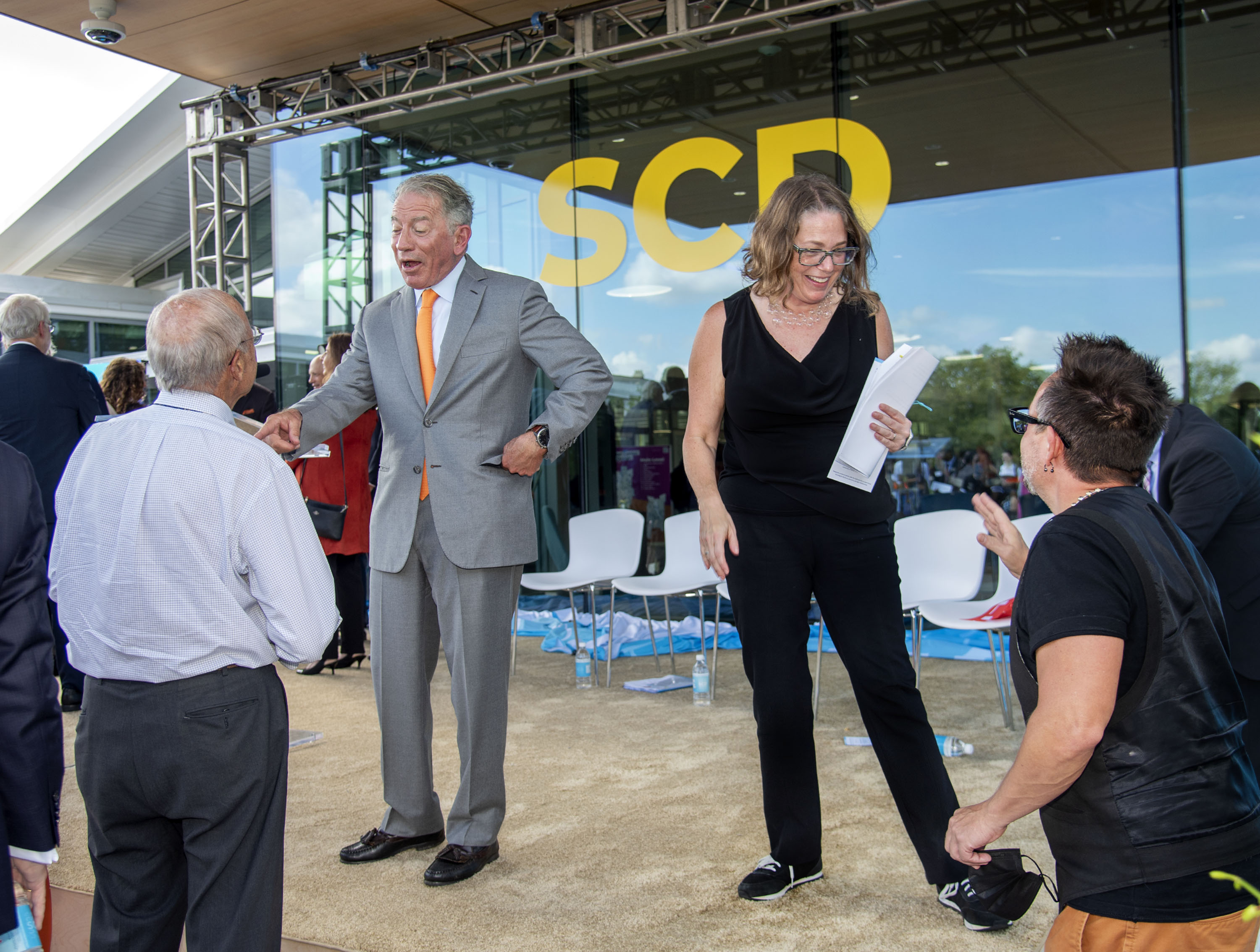 Photo of Tom Siebel and Rachel Switzky making the rounds following a formal dedication of SCD.