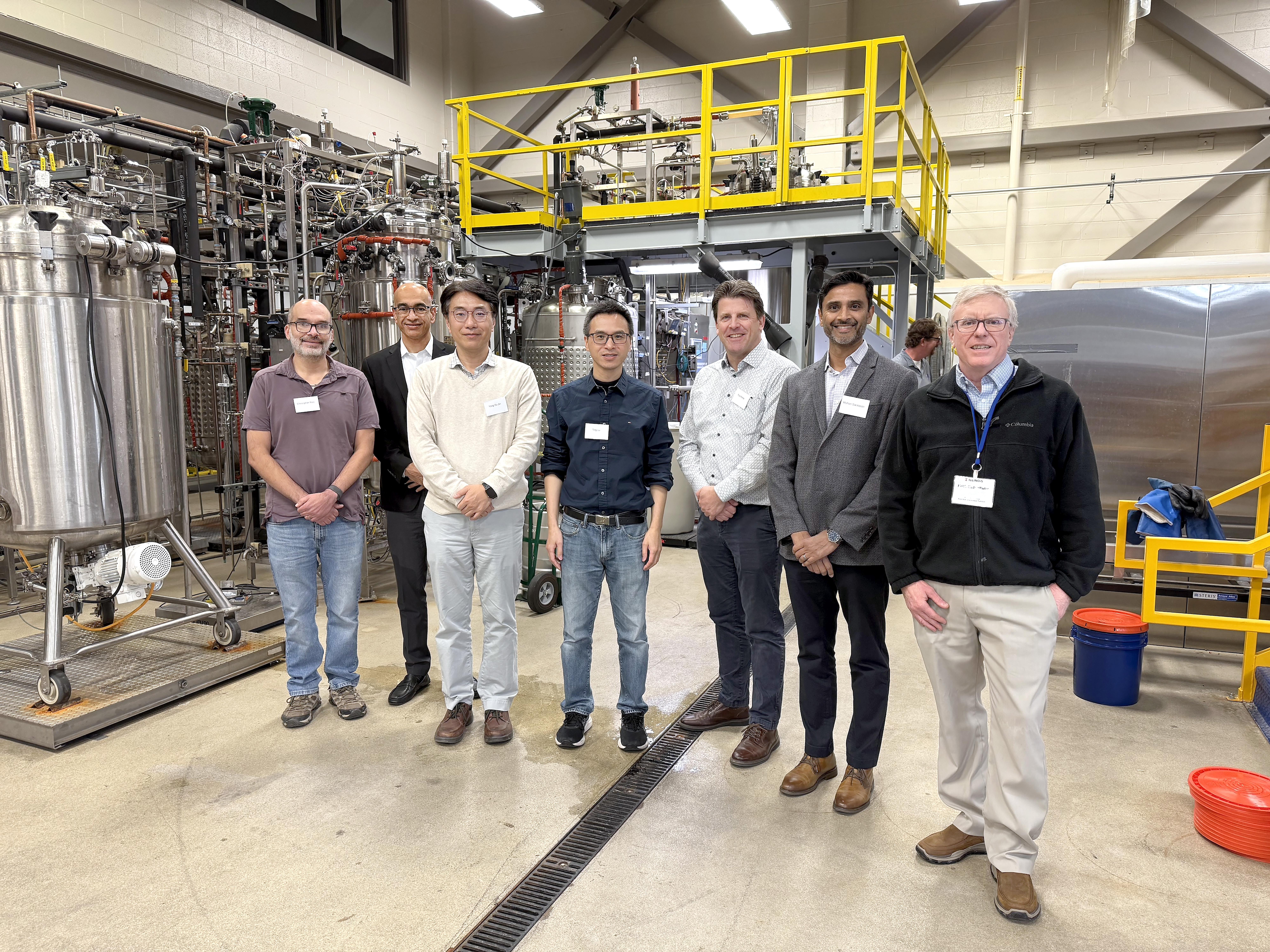 Ting Lu (Bioengineering), center, the Illinois lead principal investigator of Cornucopia, joins fellow investigators from left: Christopher Rao (ChBE), Vijay Singh (ABE), Yong-Su Jin (FSHN), Ting, Paul Kenis (ChBE), Mohan Sankaran (NRPE), and Keith Cadwallader (FSHN) at the Integrated Bioprocessing Research Laboratory (IBRL).Lu is the Illinois lead of Cornucopia, a biomanufacturing initiative funded by the Defense Advanced Research Projects Agency (DARPA) that aims to produce nutritious, palatable and safe food using minimal resources. (from Jeni Bushman's story)