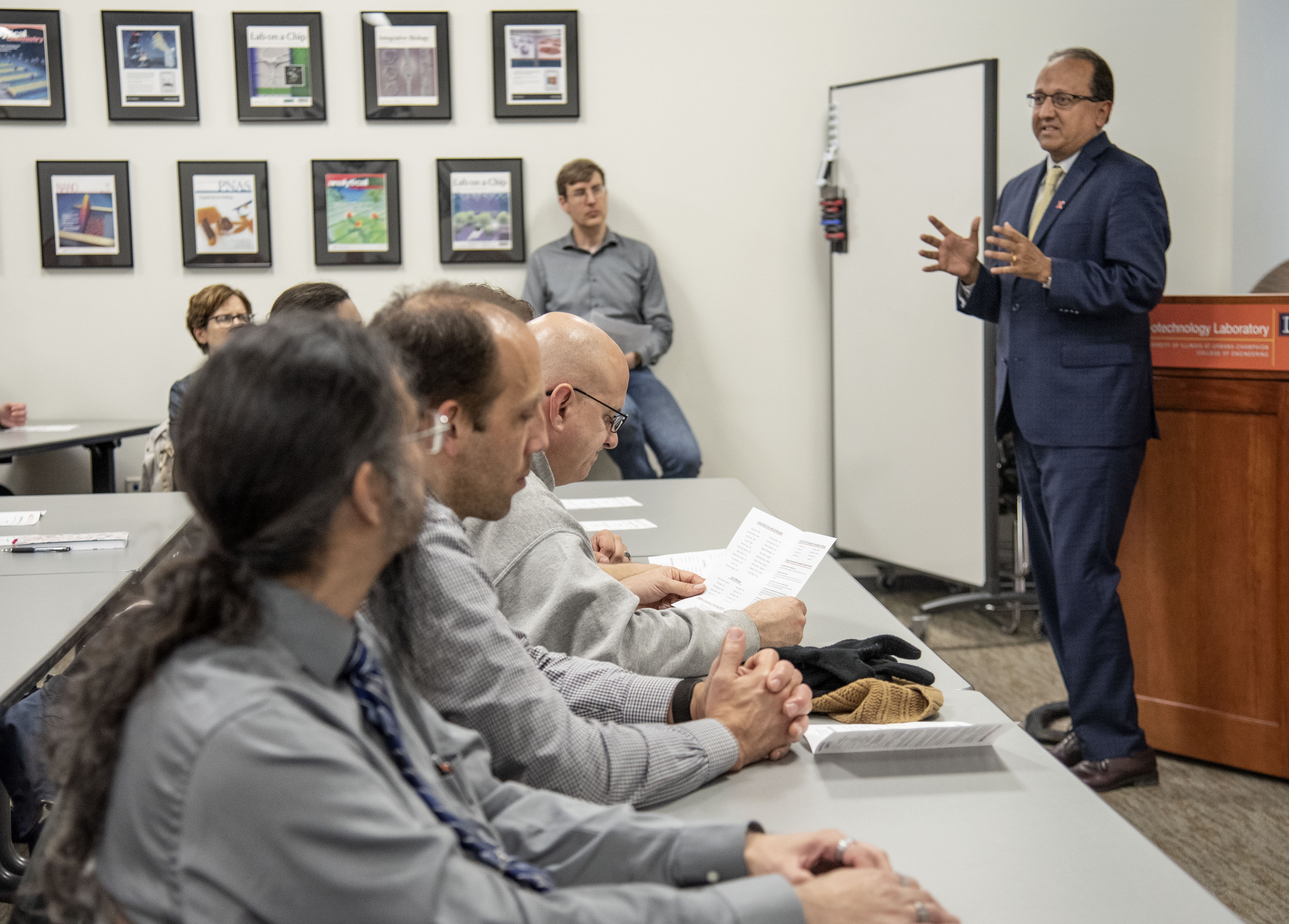 Dean Rashid Bashir speaks to a room of colleagues