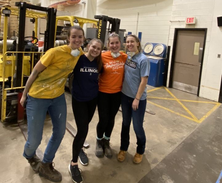Grace Kramer and friends near concrete canoes