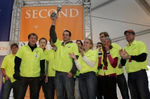 ABE grad student Mark Adams holds the trophy high as the students celebrate their second place finish.