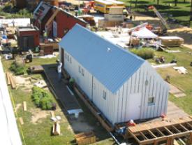 A view of the Illinois Gable Home being set up on the National Mall. Photo by Richard King/U.S. Department of Energy Solar Decathlon.