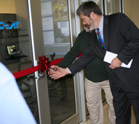 Professor David Lange cuts the ribbon at the new CEAT work space.