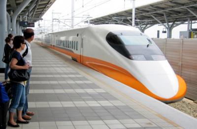 Professor T.C. Kao and his wife, Mei, wait to board a high-speed train in Taiwan.