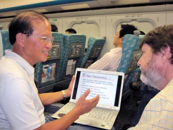 Professors T.C. Kao and Chris Barkan discuss the high-speed rail course at Illinois while traveling on the Taiwan high-speed rail line.