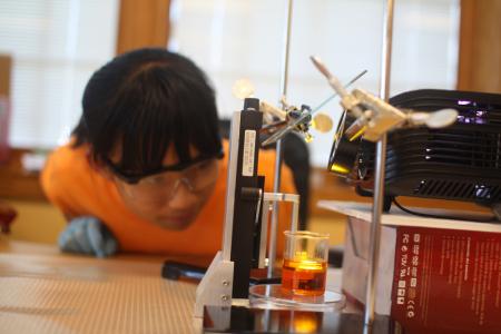 A Next Generation Middle School[cr][lf]student is creating a 3D object with a classroom 3D printer based on[cr][lf]research conducted at Illinois.