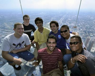 Students pose on the Ledge at Willis Tower in Chicago.