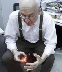 Nick Holonyak Jr. holding an LED