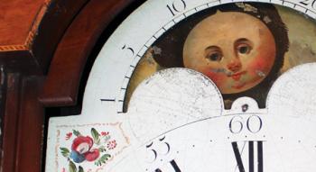 Detail of the moon dial on the grandfather clock in the University president's office.