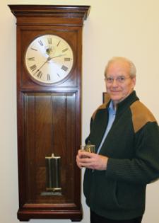 Bruce Hannon with his favorite campus clock in Engineering Hall.