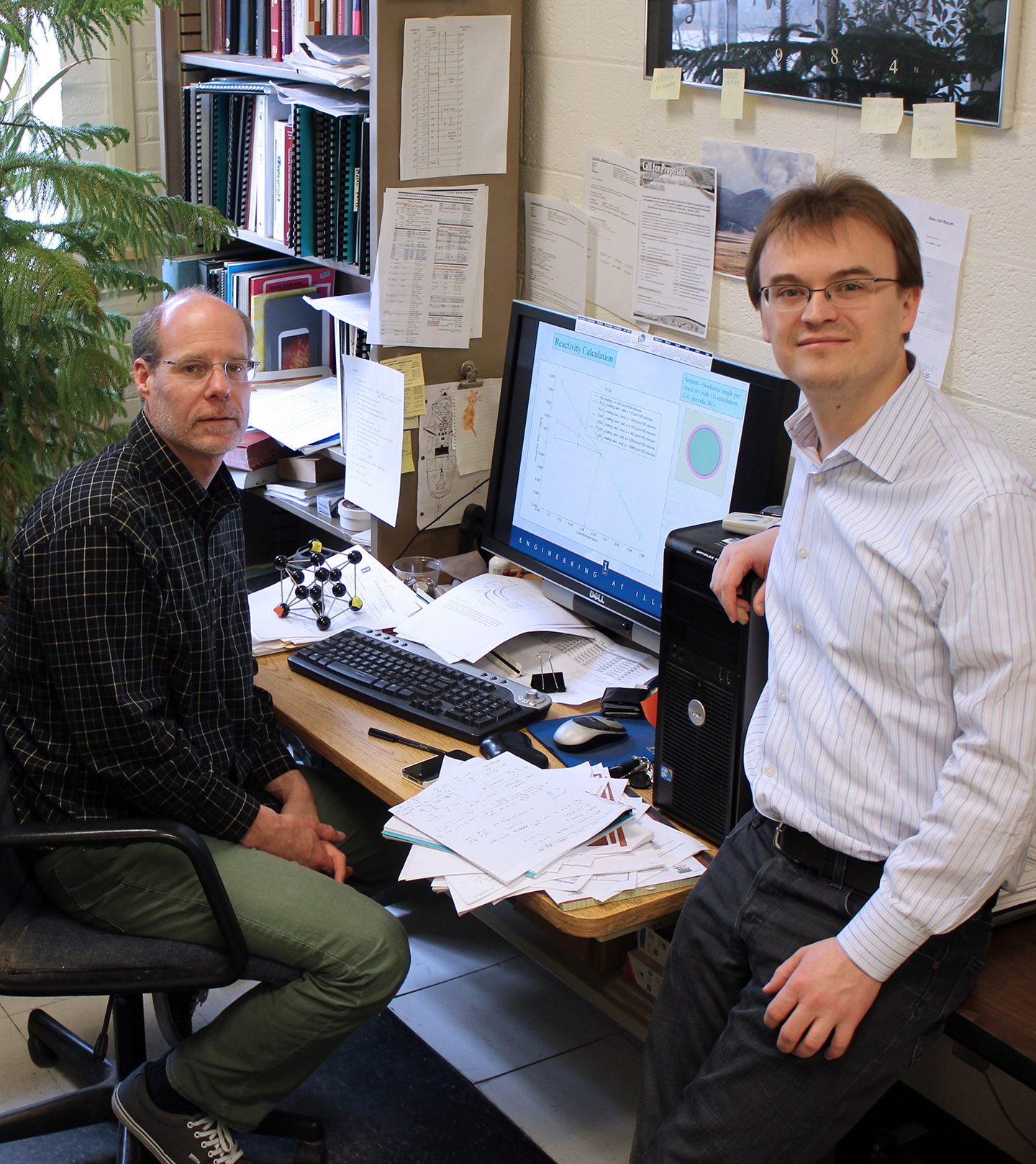 Tomasz Kozlowski (right) is providing computer simulation support for the DOE-funded multi-institutional project to develop improved cladding for nuclear fuel rods led by NPRE professor Brett Heuser (left).