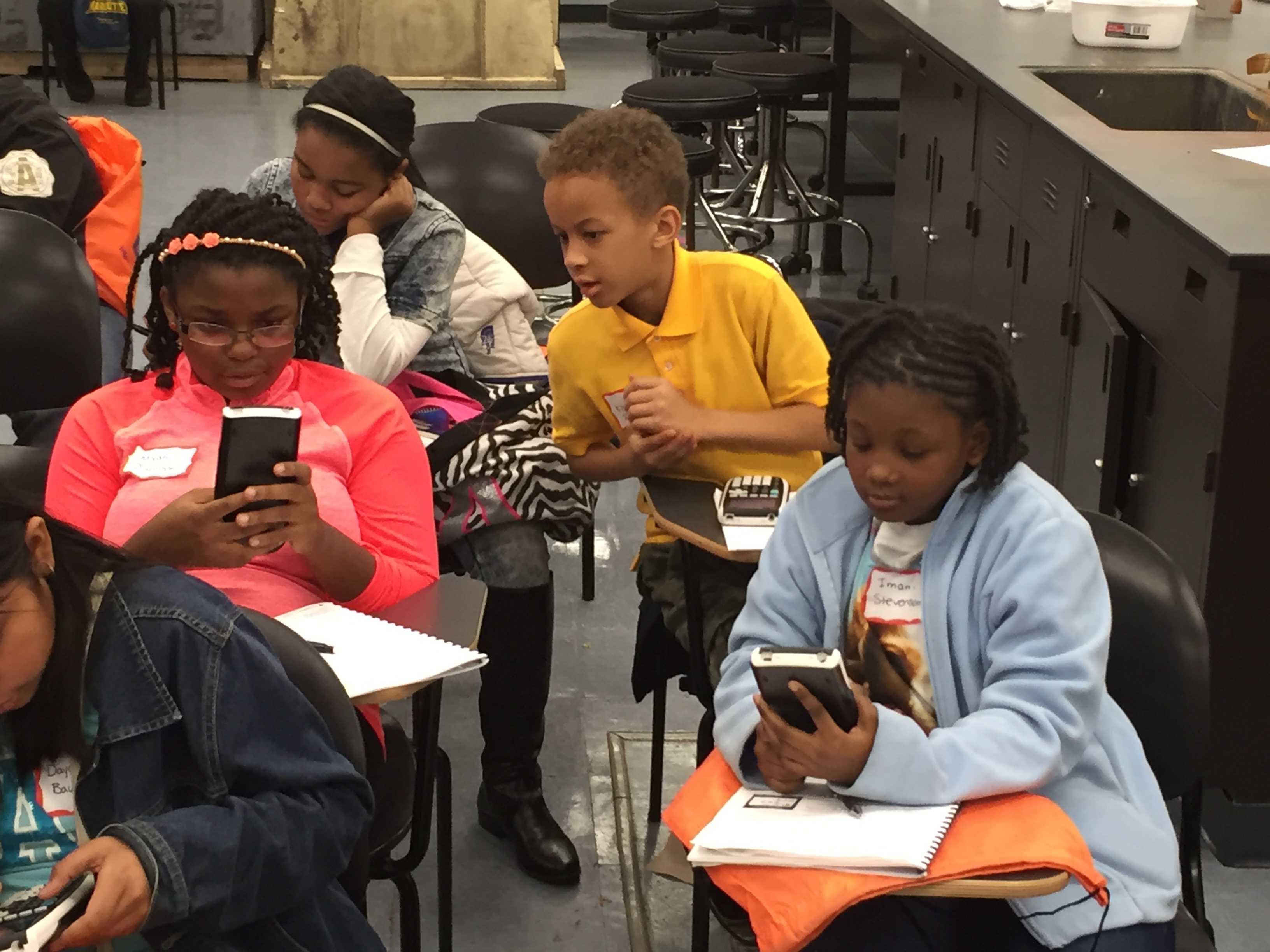 Students used a graphing calculator for the first time at the Oct. 24 workshop.