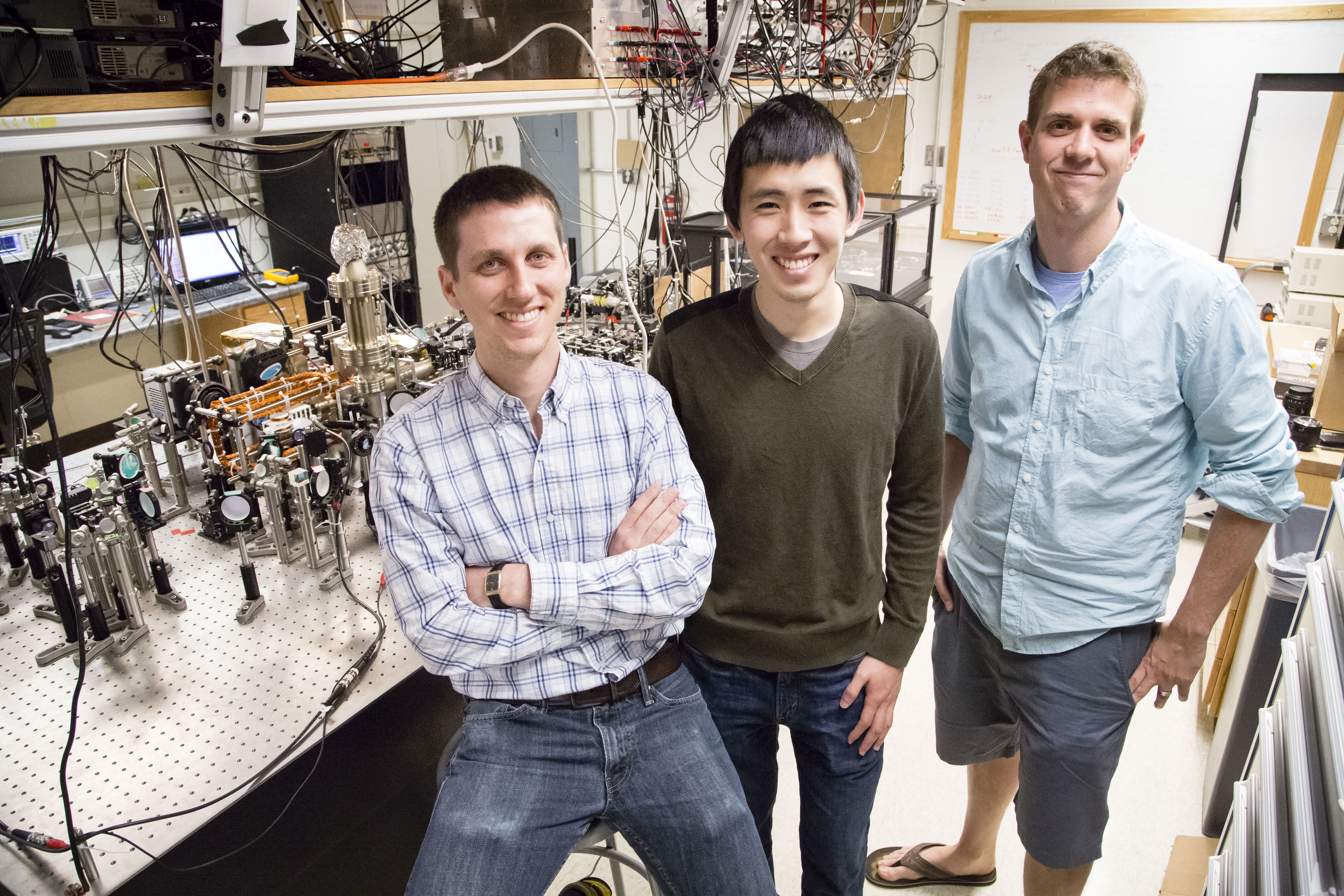 (l to r) Graduate students Eric Meier and Fangzhao Alex An with Bryce Gadway in Loomis Laboratory.