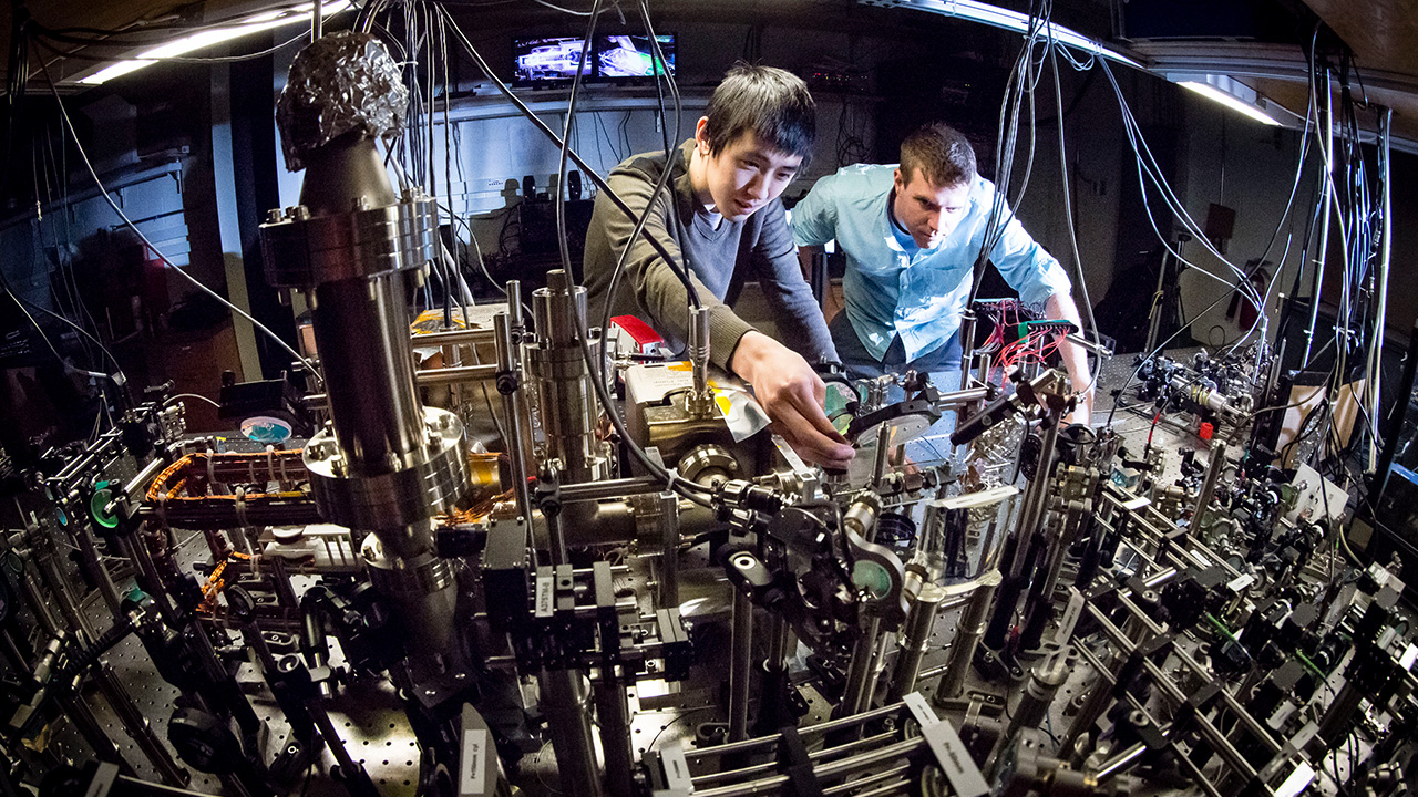 Graduate student Fangzhao Alex An working with Physics Professor Bryce Gadway at Loomis Laboratory.