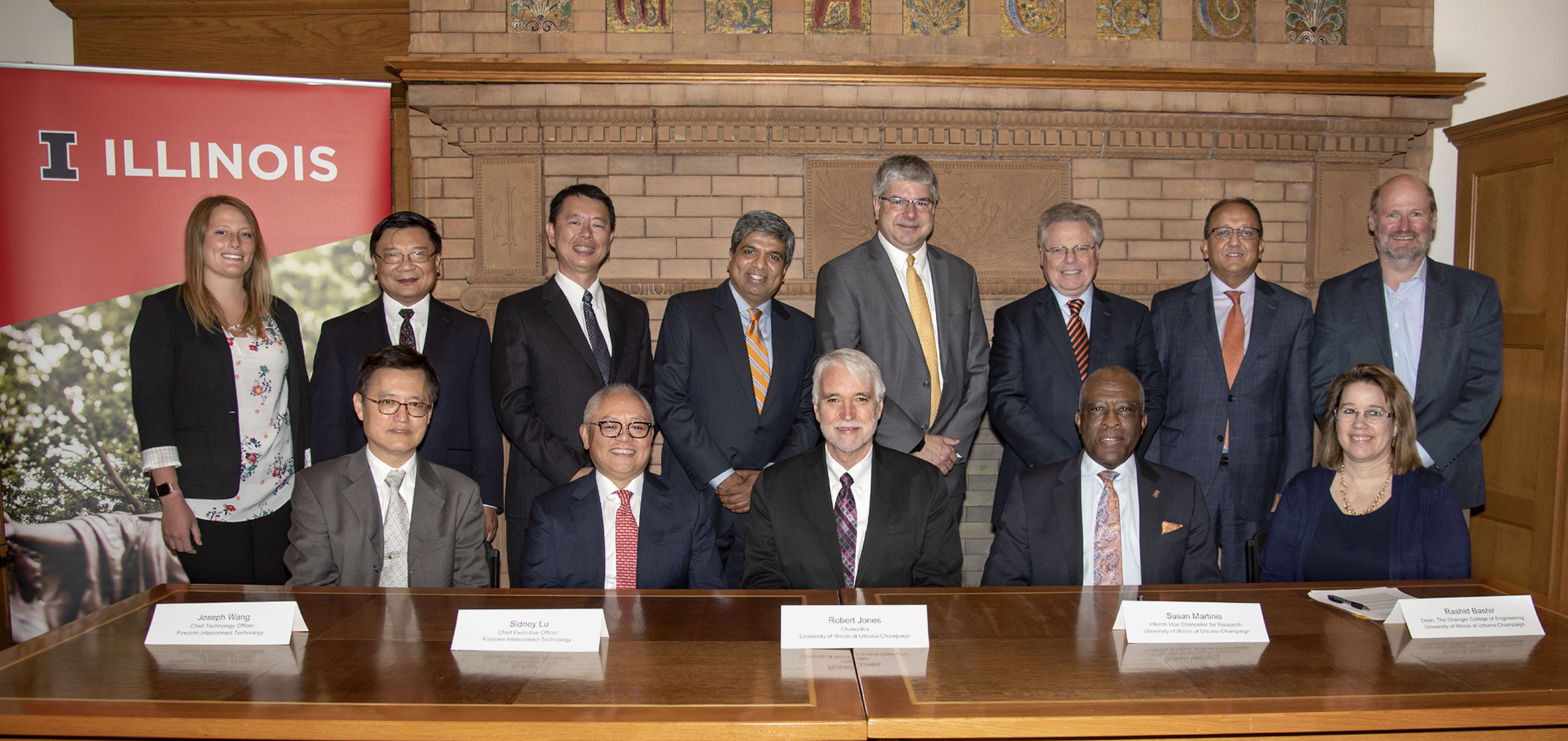 Sidney Lu (BS, ME '81, front third from left), CEO of Foxconn Interconnect Technology Ltd. joins other representatives from FIT and the University of Illinois to sign the FIT-Illinois R&D Center letter of intent during a signing ceremony at Engineering Hall in Urbana on July 1.