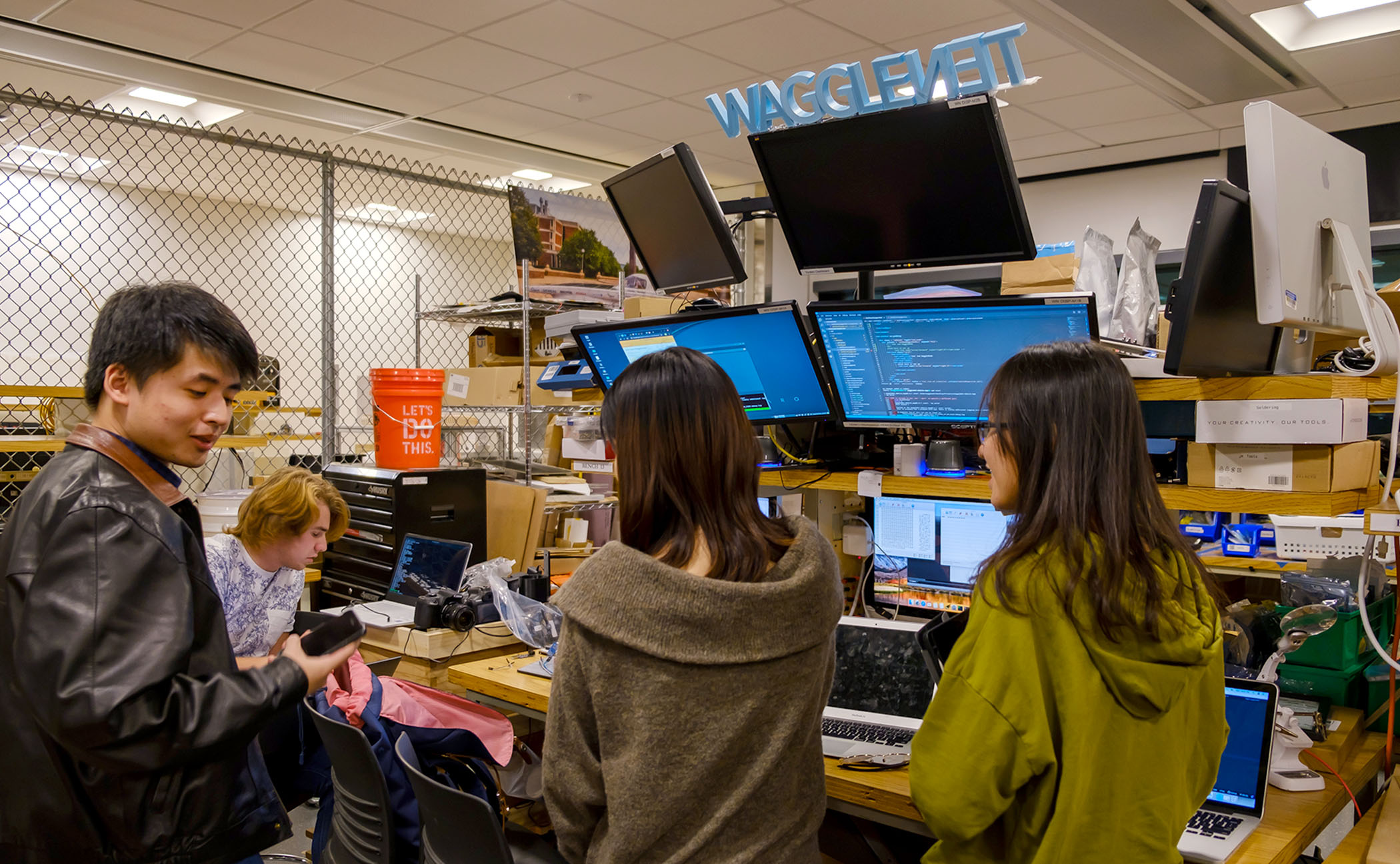 WaggleNet members work late at night solving high-priority problems at their station inside ECE Open Lab.