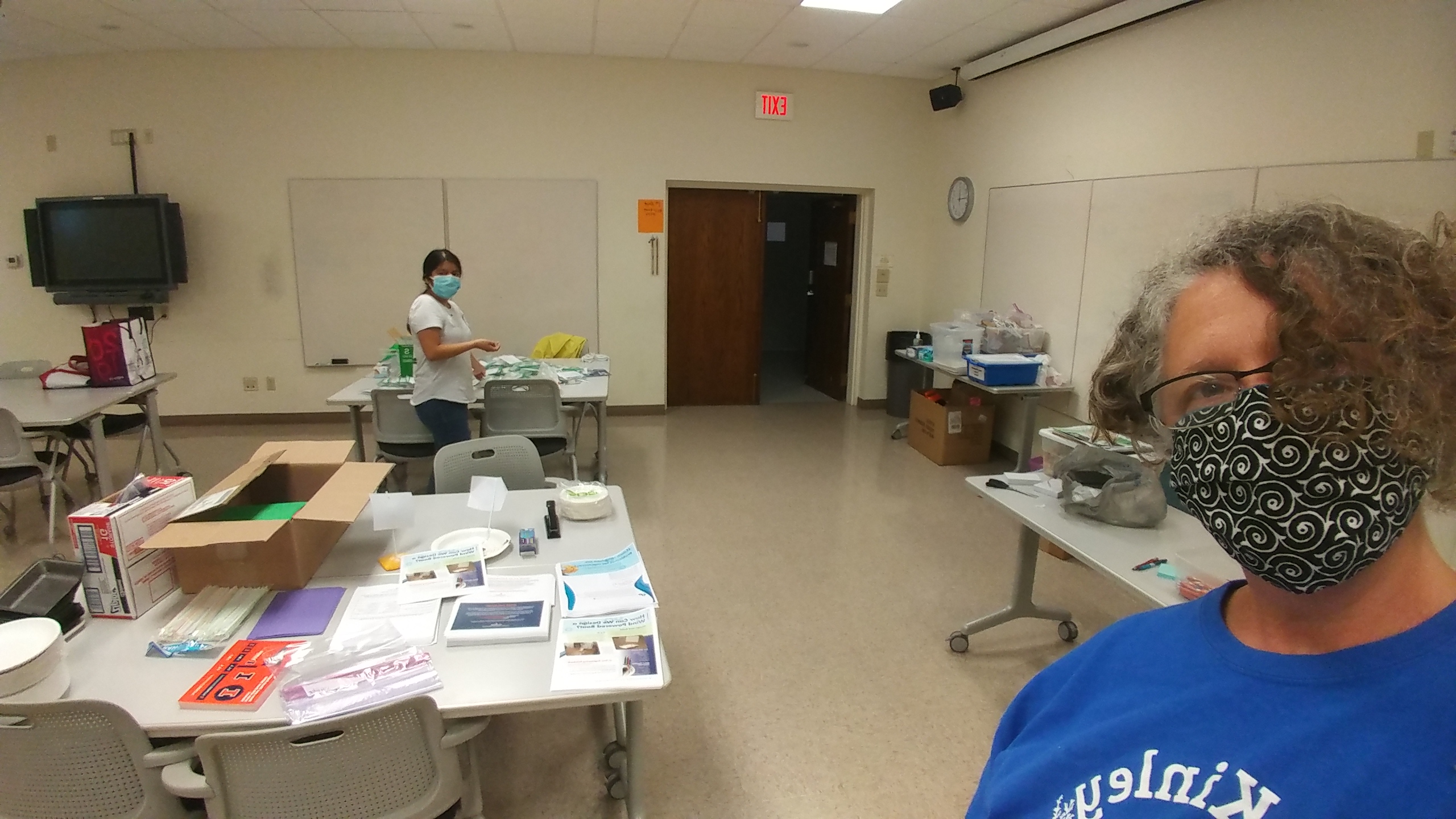 Lara Hebert and the outreach staff prepare STEM kits.