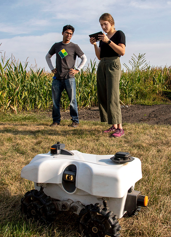 Chinmay instructs student on how to control robot