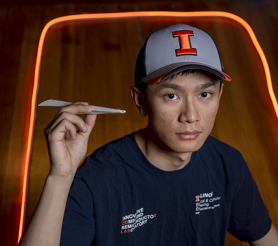 Yu-Chieh Chiu holding a paper airplane