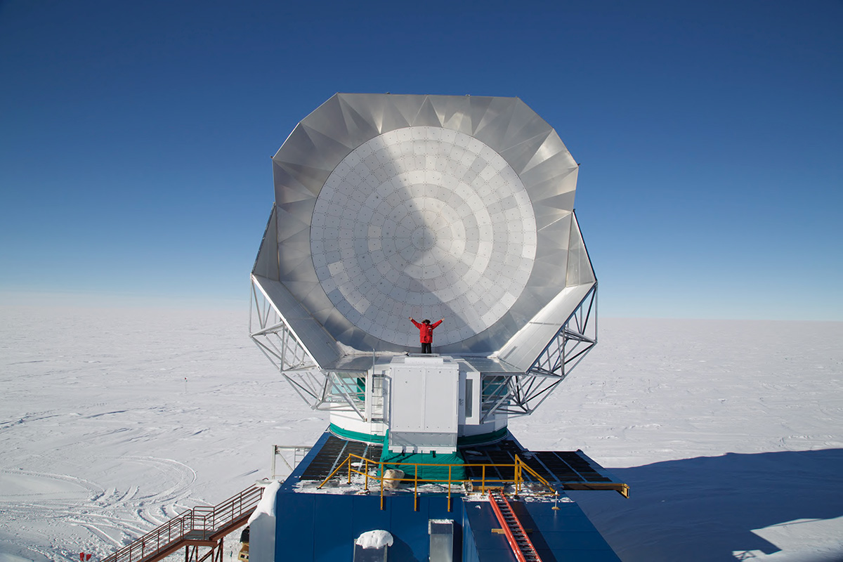 Vieira standing in front of the telescope