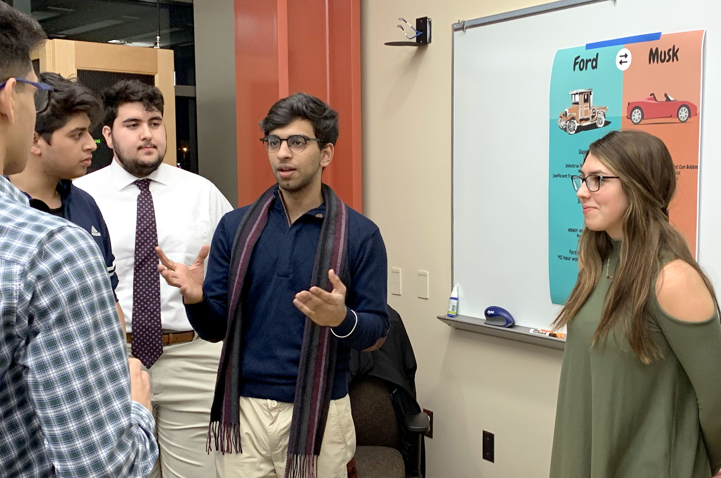 Students discussing a project in an active learning space