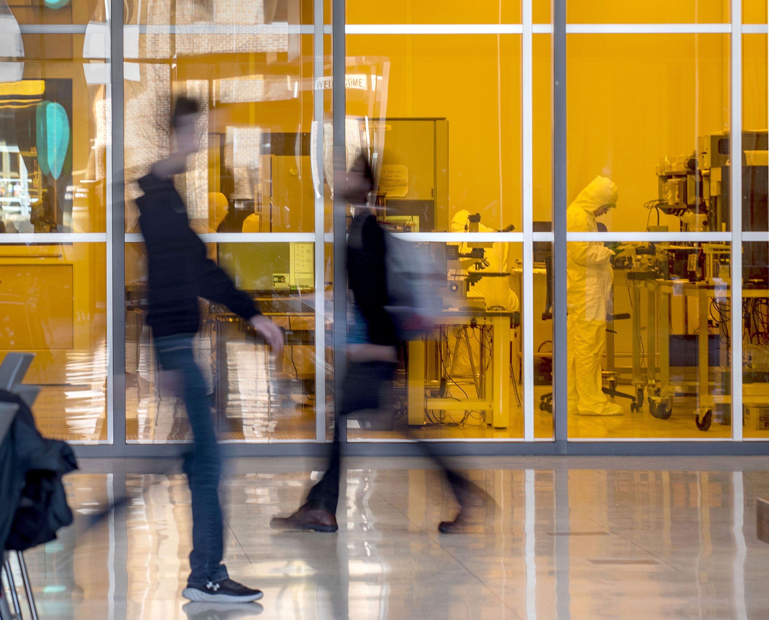 Two worlds co-exist as students pass the Nano Fabrication Lab at&amp;amp;nbsp;the Electrical and Computer Engineering Building.