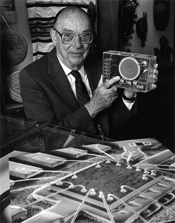 John Bardeen demonstrating the transistor