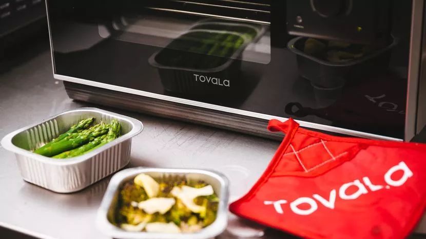photo of tovala device with small trays of food