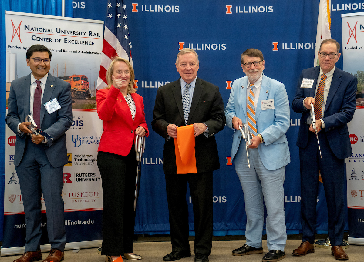 Official ribbon-cutting attended by federal and state dignitaries, including Federal Railroad Administration Administrator Amit Bose, Illinois Senator Dick Durbin, Illinois Representative Nikki Budzinski, Illinois Department of Transportation Secretary Omer Osman, and university officials.