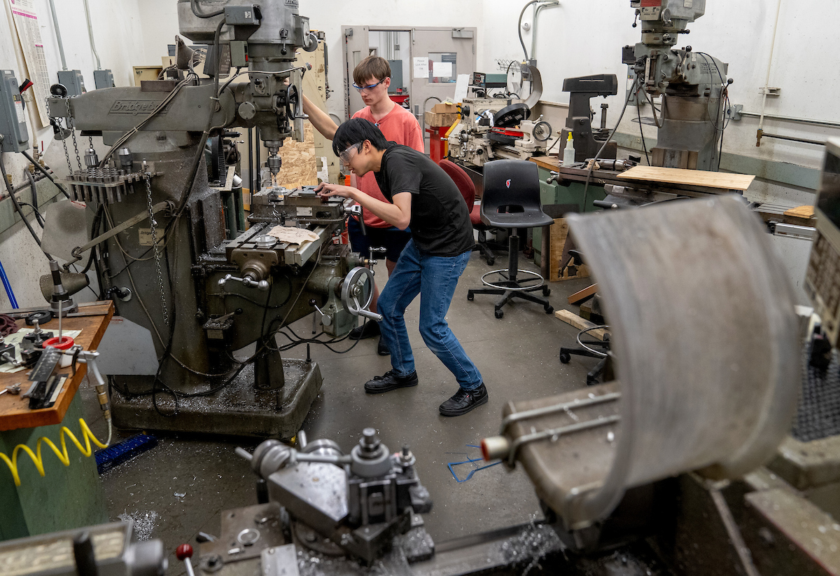 iRobotics students work with machines in the Engineering Student Projects Laboratory.