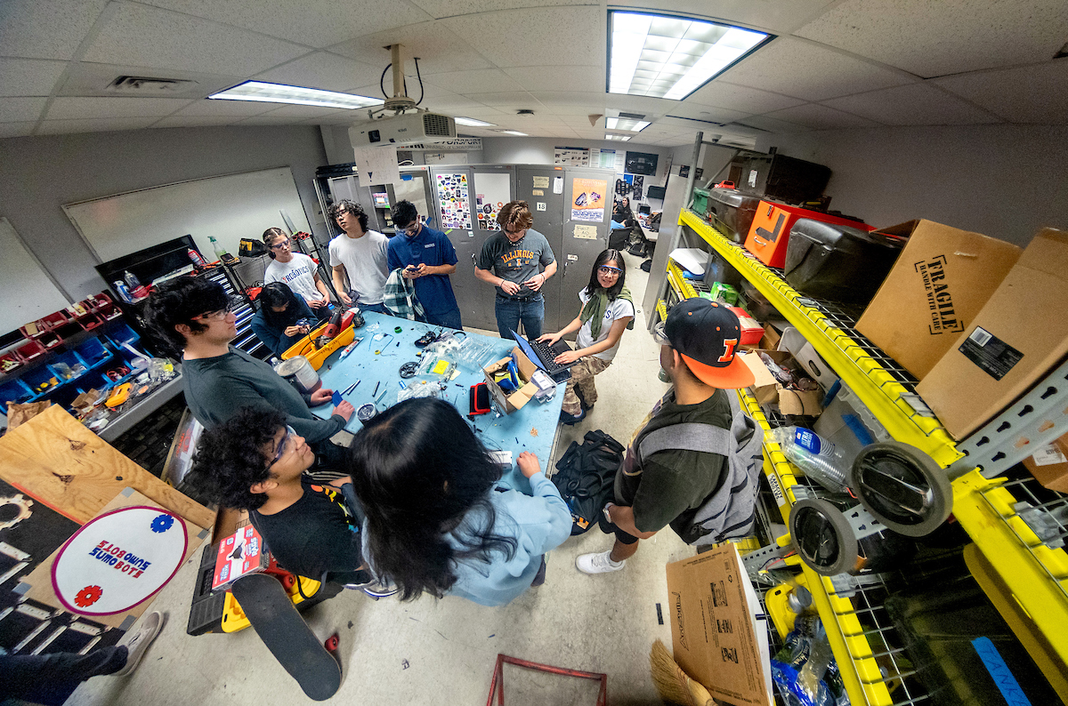 Overhead view of students meeting Engineering Student Project Laboratory.