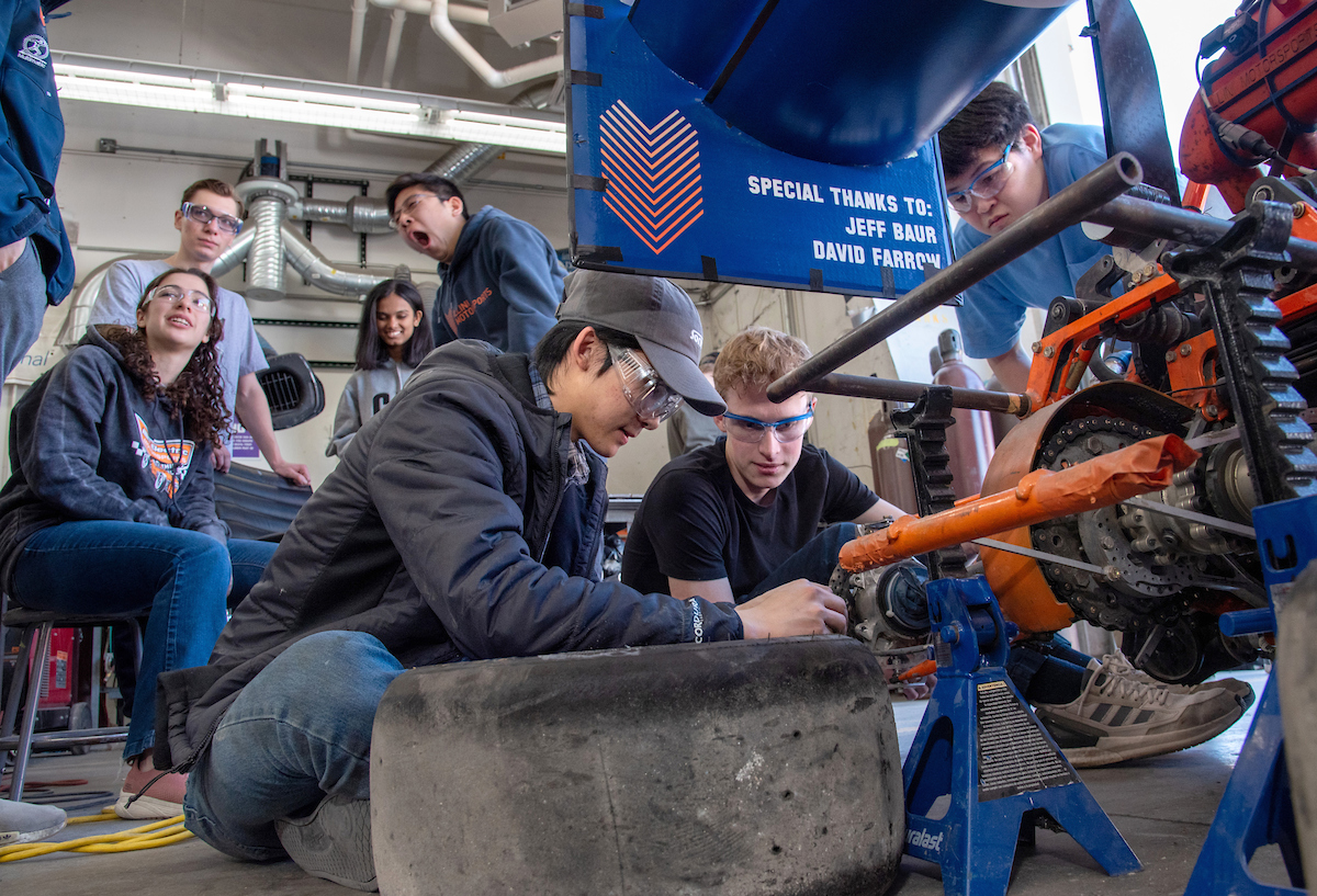 U of I. students working on car parts in the Engineering Student Project Laboratory.