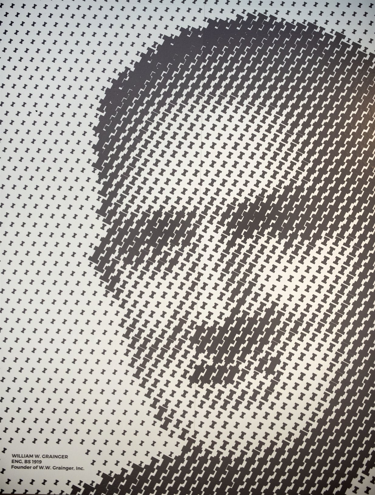 A mural image of William W. Grainger, a 1919 alumnus, is made up of Block I's at the Campus Instructional Facility.