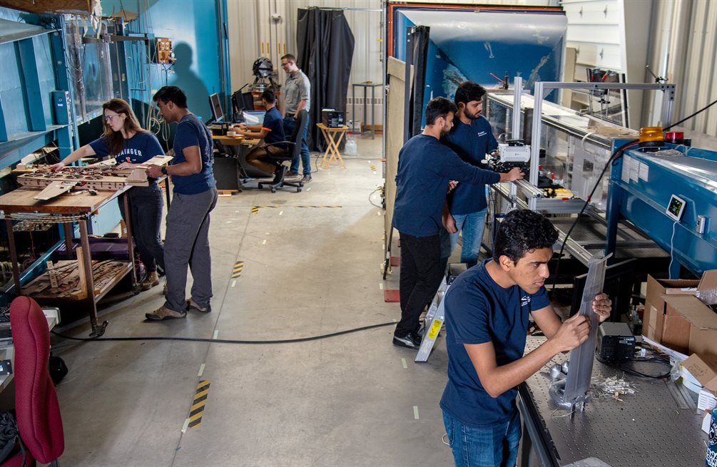 Aerospace Engineering graduate students works inside the Aerodynamics Research Lab as part of Aerospace Engineering professor Phil Ansell's Aerodynamics and Unsteady Flows Research Group in February 2023.