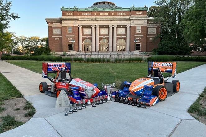 Motorsports cars with all of their trophies.