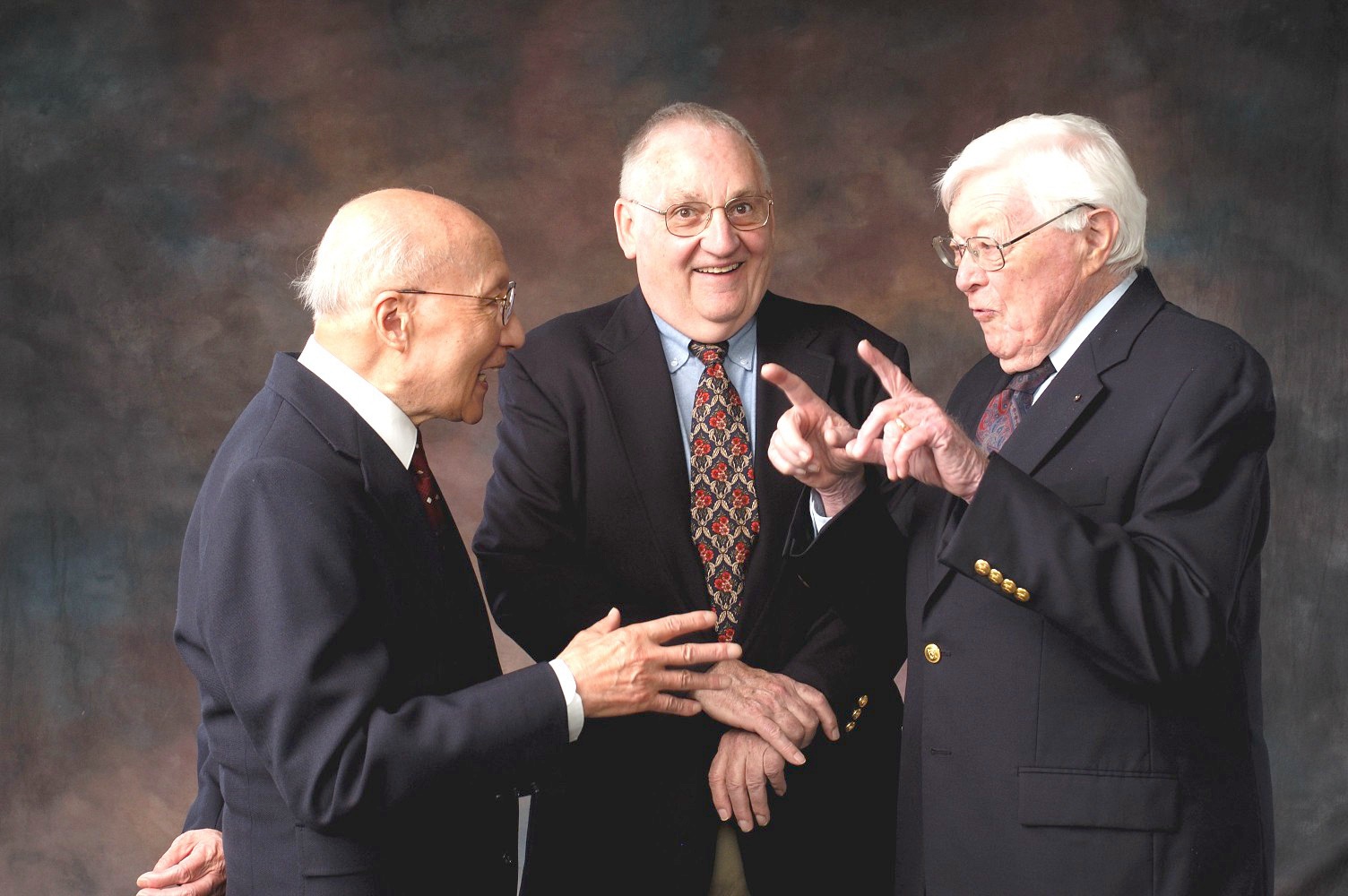 B.T. Chao, Alva &amp;amp;amp;acirc;&amp;amp;amp;euro;&amp;amp;amp;oelig;Tad&amp;amp;amp;acirc;&amp;amp;amp;euro;&amp;amp;Acirc;&amp;Acirc;&Acirc;Â Addy and Helmut Korst smile and gesture to one another while sharing an amusing story during a photo shoot.