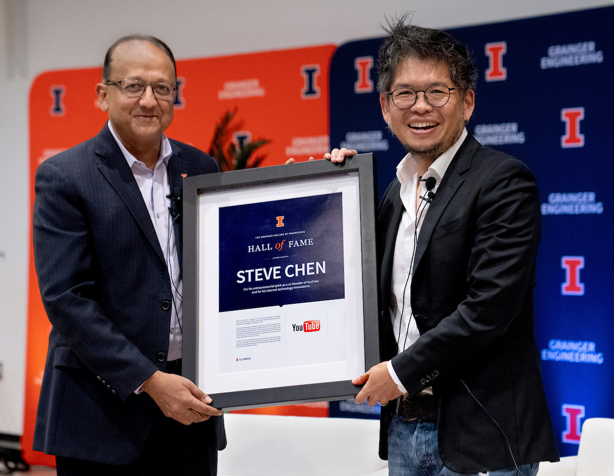 Steve Chen, right, co-founder of YouTube and former Grainger Engineering student, formally joins the college's Hall of Fame during a presentation by dean Rashid Bashir.