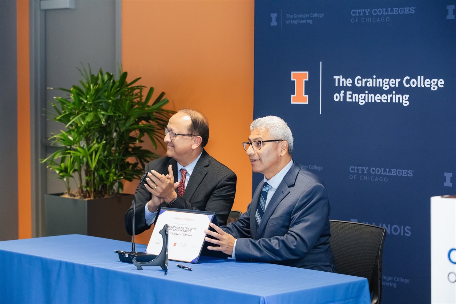 Dean Rashid Bashir (right), The Grainger College of Engineering and Chancellor Juan Salgado, City Colleges of Chicago signing the partnership between Grainger Engineering and City Colleges of Chicago to expand educational accessibility.