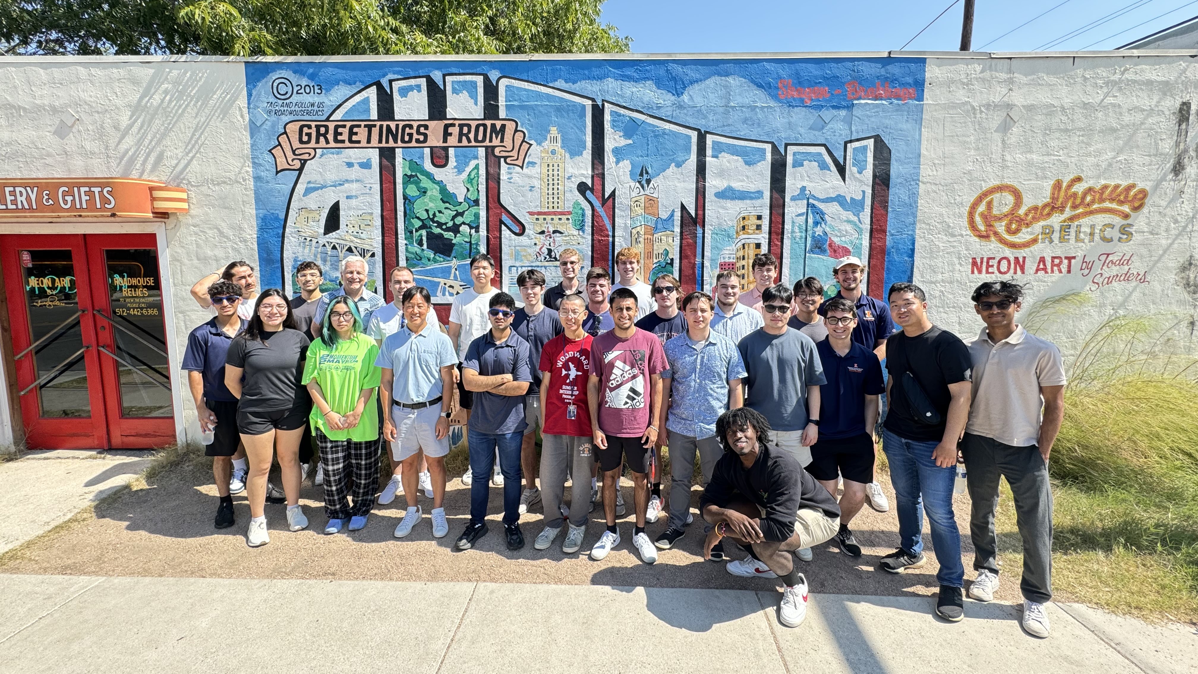 A group of students standing in front of a mural that says &amp;amp;amp;amp;quot;Austin&amp;amp;amp;amp;quot;