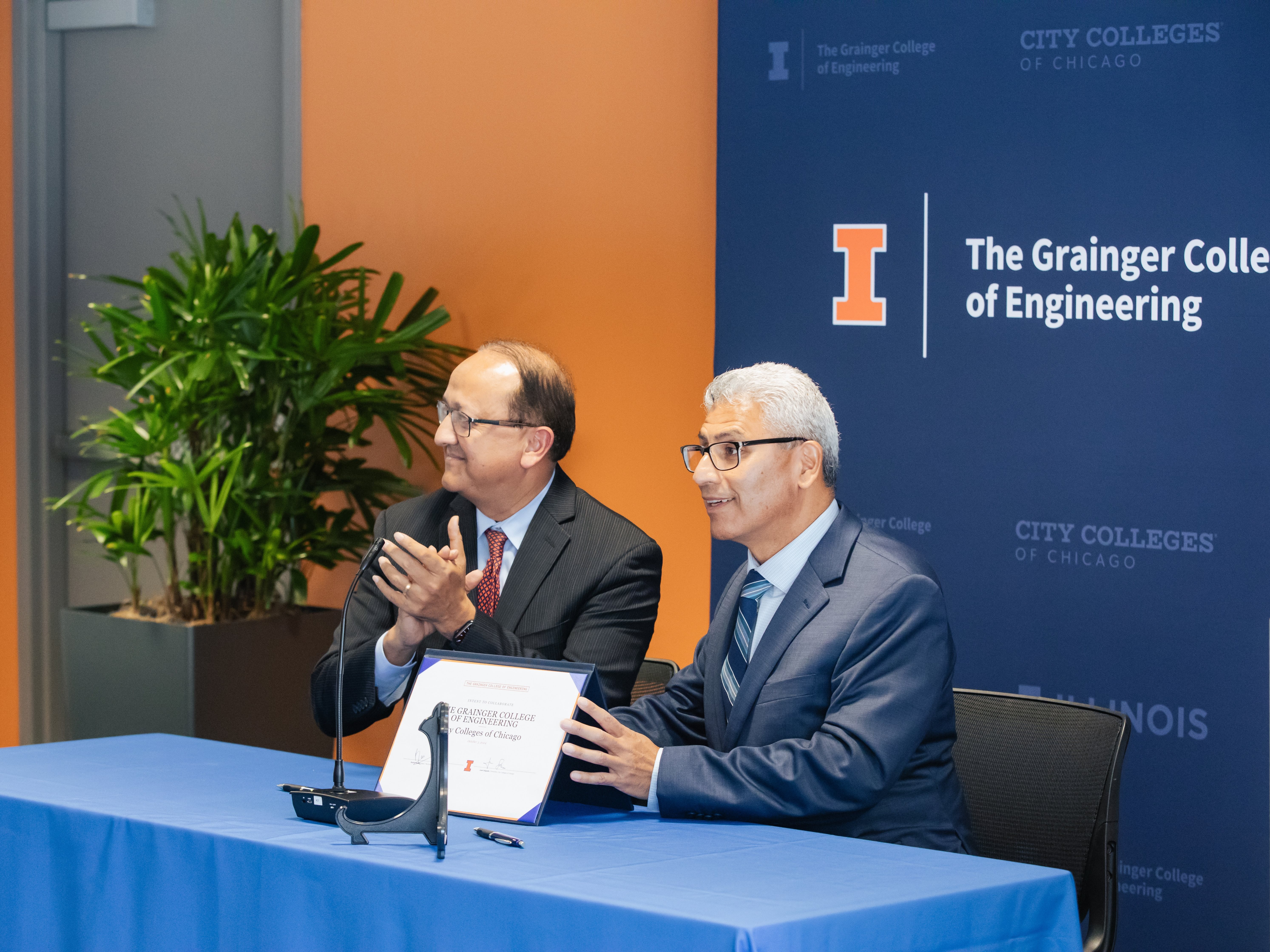 Dean Rashid Bashir (right), The Grainger College of Engineering and Chancellor Juan Salgado, City Colleges of Chicago signing the partnership between Grainger Engineering and City Colleges of Chicago to expand educational accessibility.